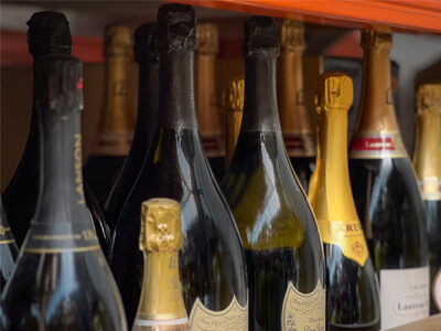 Alcohol bottles on a warehouse shelf - Champers Drinks