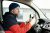 Driver in var holding driving wheel - Champers Drinks