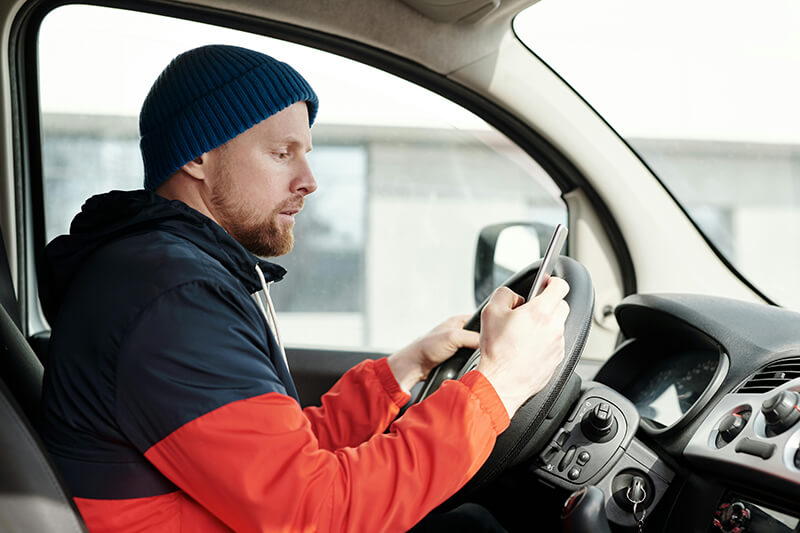 Driver in var holding driving wheel - Champers Drinks